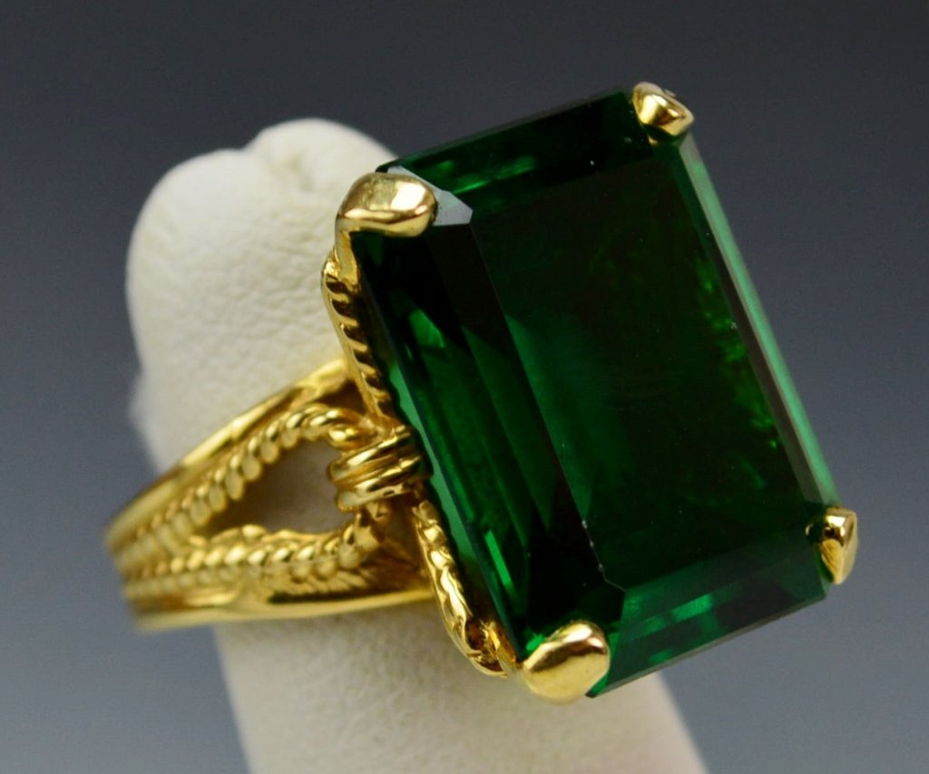 14k Yellow Gold Cocktail Ring: 14k ladies cocktail ring, size 6 and 7.4 dwt. Center synthetic green spinel. Small fleck to underside of girdle, please see photo.
