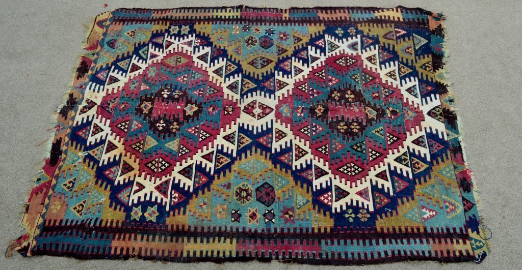 Antique Turkish Kilim: Finely woven two piece Kilim, vivid colours, decorated with geometric designs and stars with some loss, Measures: 50" x 67