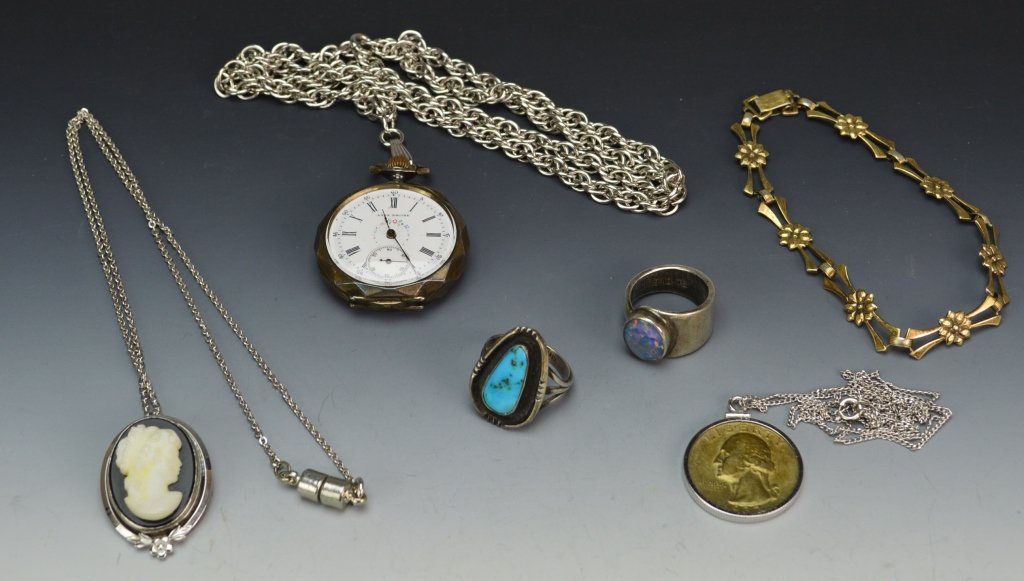 Grouping of Sterling and Other Silver Jewelry: Grouping including cameo necklace, coin necklace with 1932 Quarter, synthetic opal ring, turquoise cabochon ring, Lady Racine pocket watch with 935 silver case and a floral bracelet, 3.80 OZT