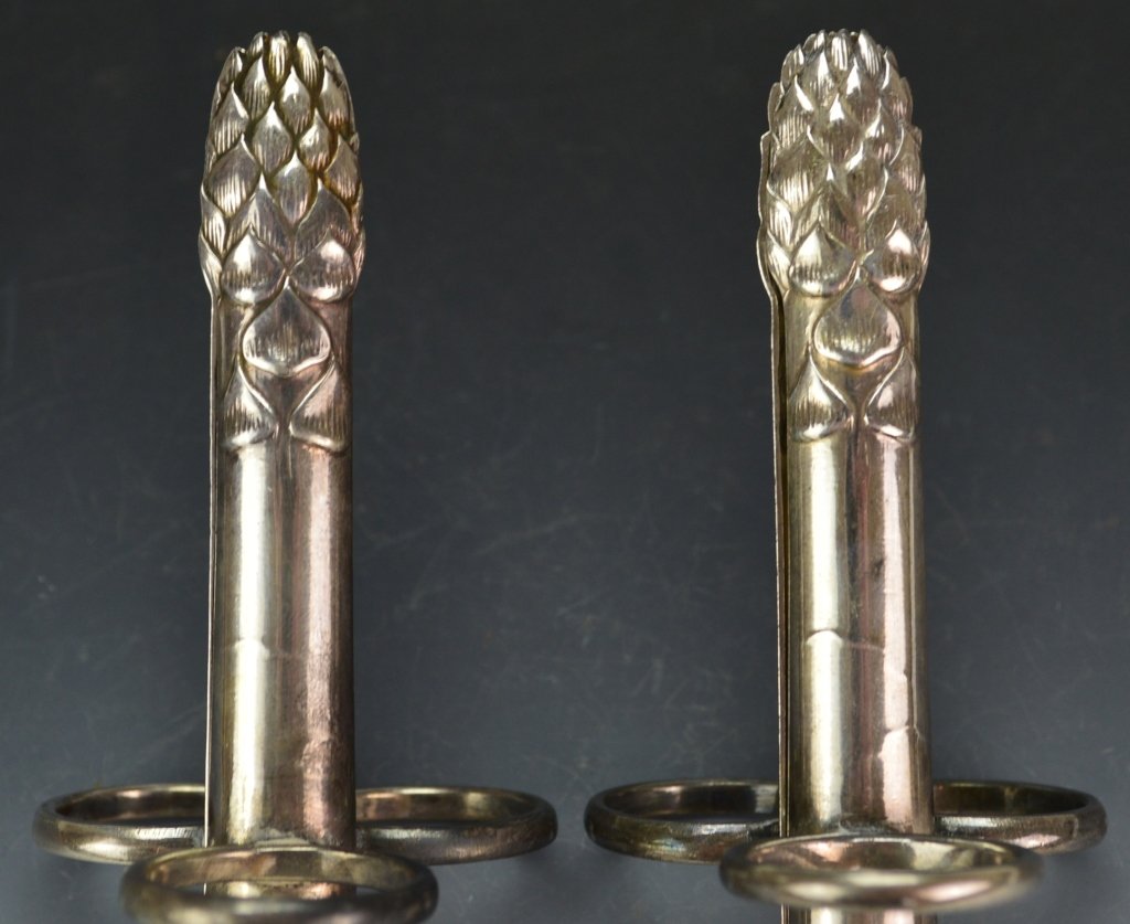 Christofle Silver Aspargus Tongs: Includes (2) Christofle hallmarked asparagus tongs. Measure 4.5"