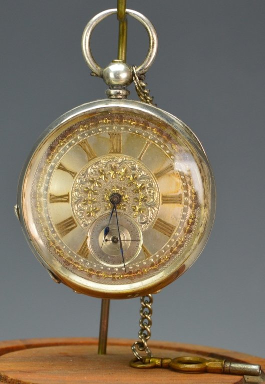Billodes Swiss .935 Silver Pocket Watch: Billodes Swiss key wind .935 silver case pocket watch with silver face. Serial # 306153. Includes key, some minor tarnishing to face. Winds and runs but not guaranteed. Measures 2.125"