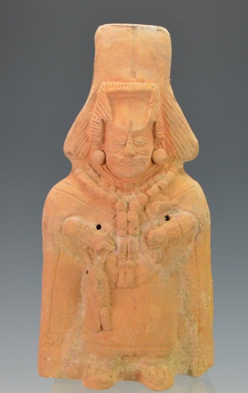 Maya Figural Rattle : Christie's: Jaina, C. 550-950 A.D., in the form of a standing priest, wearing a long garment, elaborate jewelry, the face with scarifications. Scarifications appear feline, possibly depicting Jaguar god. Height 9