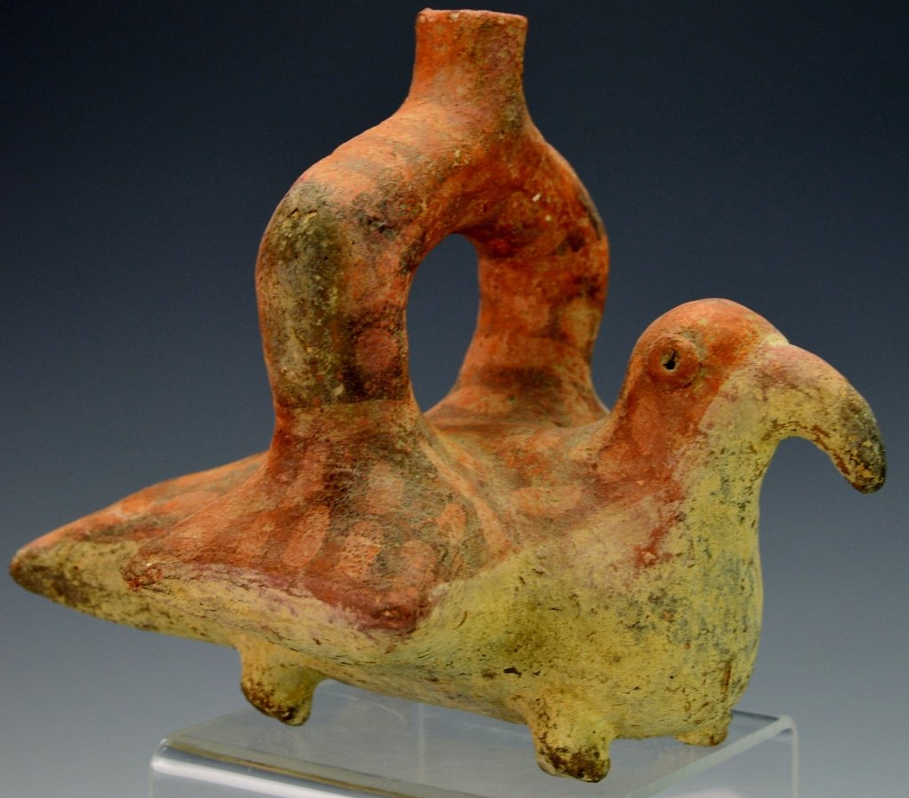 Vicus Stirrup spouted Bird-Form Vessel : Phillips: c. 100-500 A.D., with brown geometric design on back, wings an tail on four small ball feet. 6.5" x 8". Provenance: Phillips 3/27/79 auction, lot # 49. From the collection of Professor Robert Williams