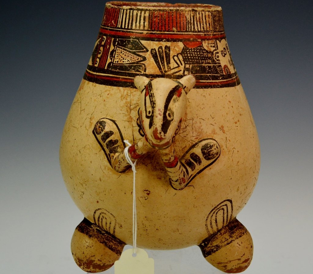 Costa Rican Polychrome Jar : Sotheby's: Guanacaste Nicoya, AD 1000-1400. on rounded tripod legs, the ovoid body in the form of a stylized squirrel, with both hands placed to the mouth, baring rows of teeth, the thin tail curled up along the