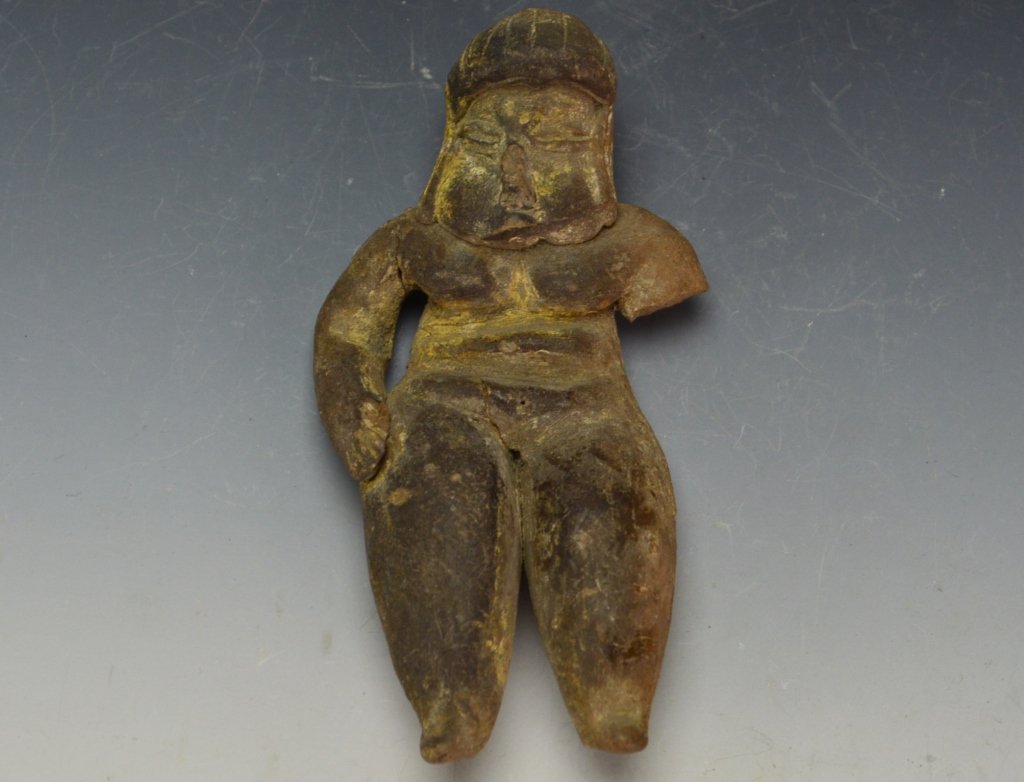 Olmec Figure: Southeastern Mexico, Guerrero, Xochipala, ca. 1000 to 500 BCE. Pottery standing figure showing strong signs of Olmec influence. Female with wide, child-bearing hips. Measures: 4". From the collection 