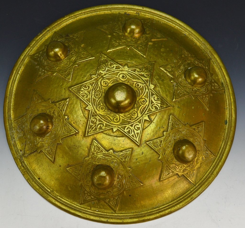 Aceh Brass Buckler: Minangkabau People for the Aceh Market, Sumatra, Indonesia 19th century diameter: 9.5" Shields or bucklers such as this example were cast by the matrilineal Minangkabau people of west Sumatra for expo