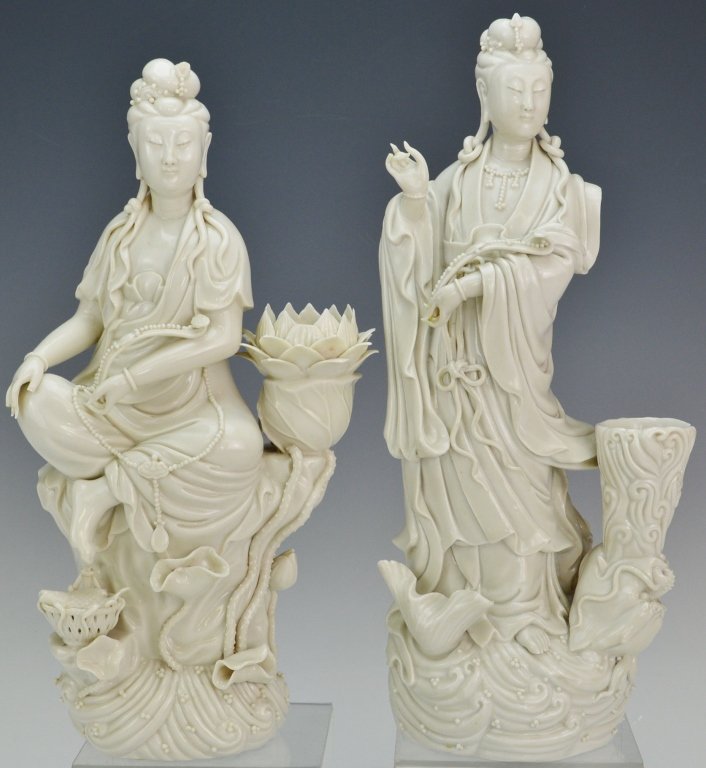 Blanc de Chine Guanyin Figures: one has minor loss to fingers and flower petals, the other the ryu scepter has been reapplied. One signed on interior. Measure 11.5" x 12"