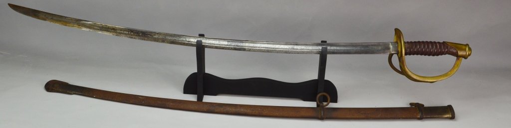 Civil War Model 1860 Cavalry Saber: Model 1860 cavalry saber with blade marked "1862" US CCS, partial Lansfield & Lamb, Crestdale R.I stamp. 35" blade, 41" overall. Retains original sheath, in original as found condition.