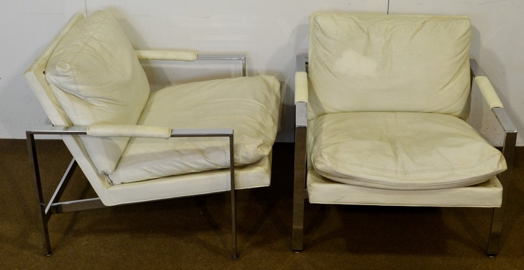 White Leather Lounge Chairs Milo Baughman: In the manner of Milo Baughman, each of the classic rectangular shape with a padded and black leather upholstered straight crest framing a cushioned back and seat between silvered arms centered by pad