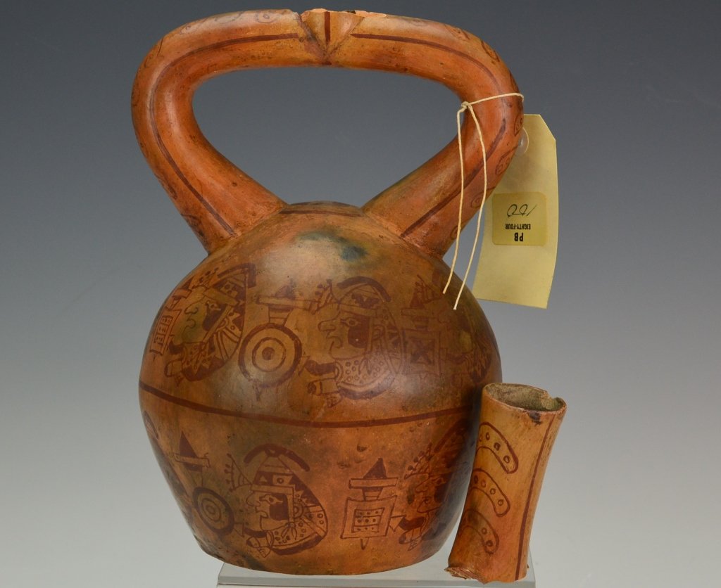 Moche Stirrup Vessel : Sotheby's: Moche. With stirrup spout and Painted red decorations of warriors with shields and weapons clothed in tiger skins. linear design through center section and other linear and geometric designs through o