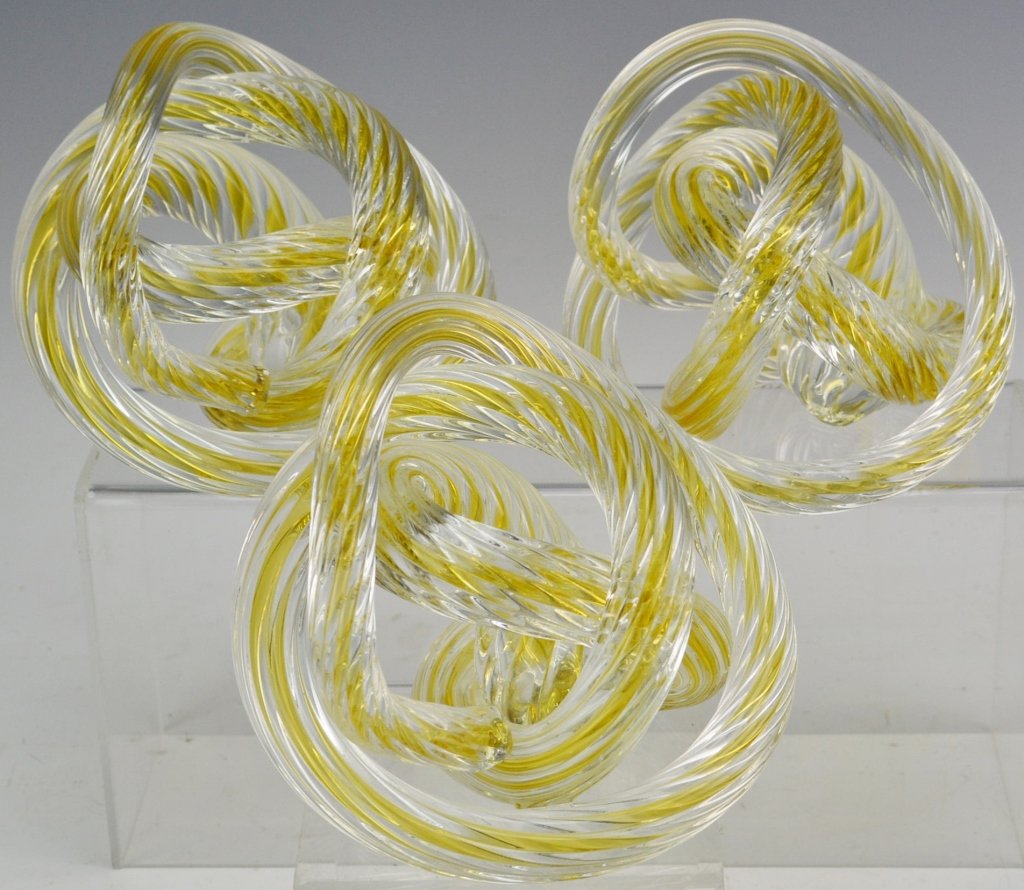 Murano Art Glass Knot Grouping: Includes (3) signed "Z" Licio Zanetti clear Murano art glass knots with gold colored piping. Measure approx. 5" x 4.5"