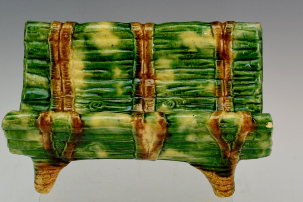 Majolica Asparagus Cradle: Majolica asparagus cradle measuring 8" x 5.5" x 3.75", hallmarked but illegible. 8" x 3.75" x 5. Minor chipping. Unsigned.