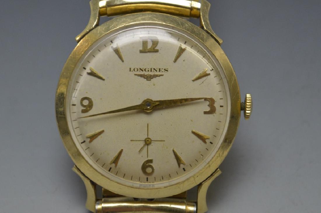 Longines 14K Solid Yellow Gold Men's Wrist Watch: This fine Longines 14K Gold Men's watch was cleaned and was working at the time of the sale. This fine time piece has an adjustable band which accommodates multiple size wrists. . Marked, "Longines Wa