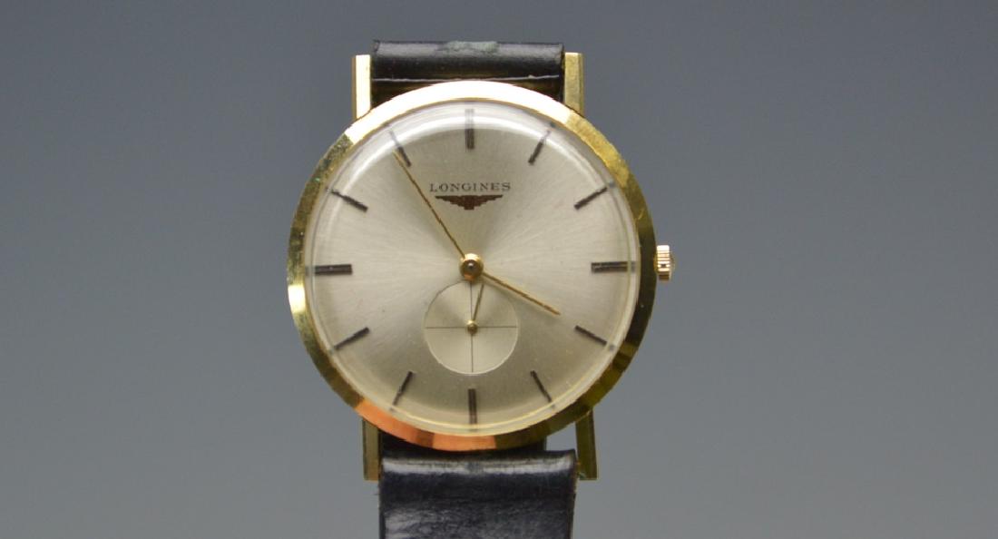 Longines 14K Solid Yellow Gold Men's Wrist Watch: This fine vintage Longines 14K Gold Men's watch was cleaned and was working at the time of the sale. This fine time piece has an adjustable leather band which accommodates multiple size wrists. . Mark