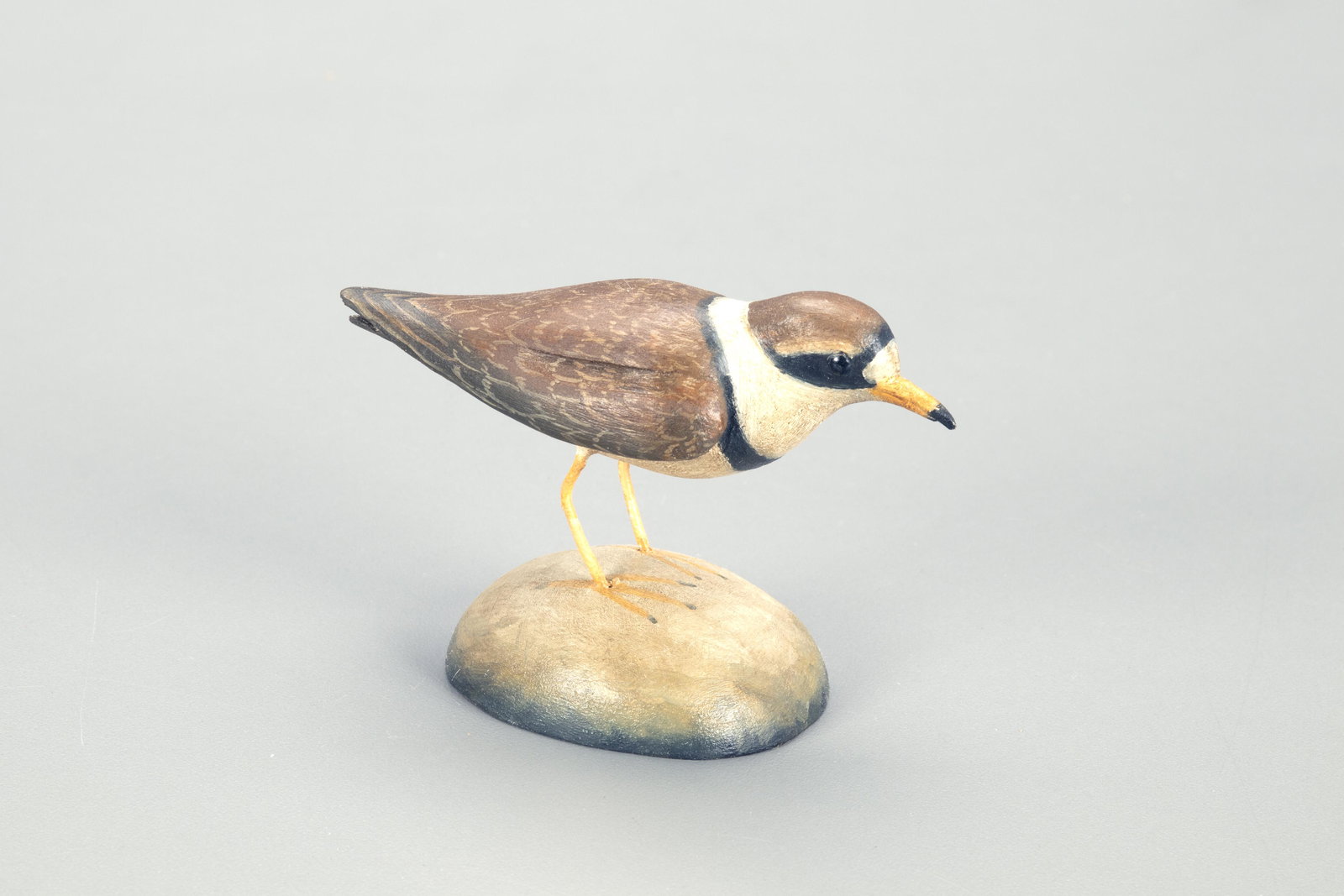Miniature Semipalmated Plover, Frank S. Finney (b.: Miniature Semipalmated Plover Frank S. Finney (b. 1947) Capeville, VA, c. 2020 3 in. tall A small plover with an incised, stylized "F" and the maker's stamp on the underside of the base. Original pain