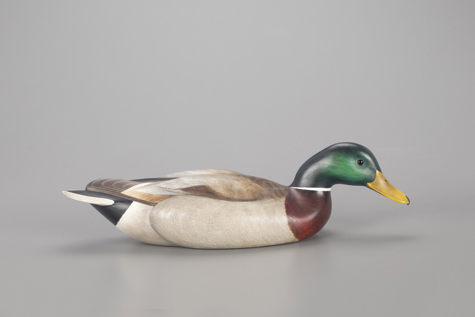 Presentation Swimming Mallard Decoy, Robert G. Kerr (b. 1935): Presentation Swimming Mallard Robert G. Kerr (b. 1935) Smith Falls, Ontario, Canada, 1971 19 in. long A mallard drake displaying carved bill detail, raised wings, and fine comb-feather paint. Along wi