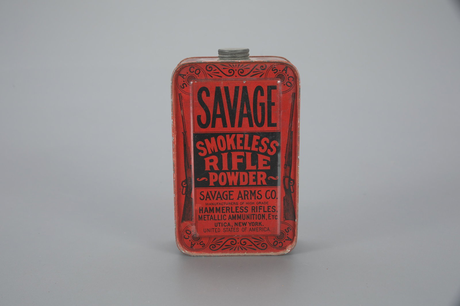 One Savage Arms Co. Smokeless Rifle Powder Tin: One Savage Arms Co. Smokeless Rifle Powder Tin 6 1/2 in. tall A rectangular tin with an image of two guns. As found. Provenance: Richard Labowskie, M.D. Collection