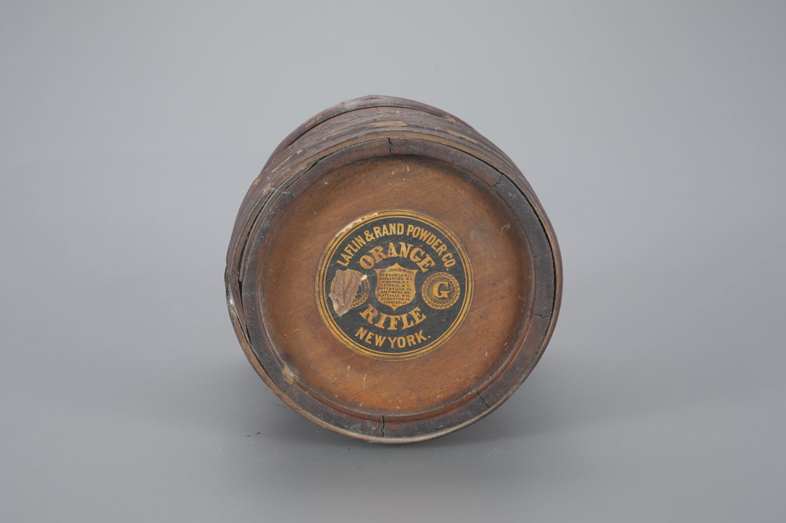 One Laflin & Rand Orange Rifle Powder Keg: One Laflin & Rand Orange Rifle Powder Keg 8 1/2 in. tall Wooden circular keg with "Laflin & Rand Orange Rifle" label and a dog label on side. As found. Provenance: Richard Labowskie, M.D. Collection