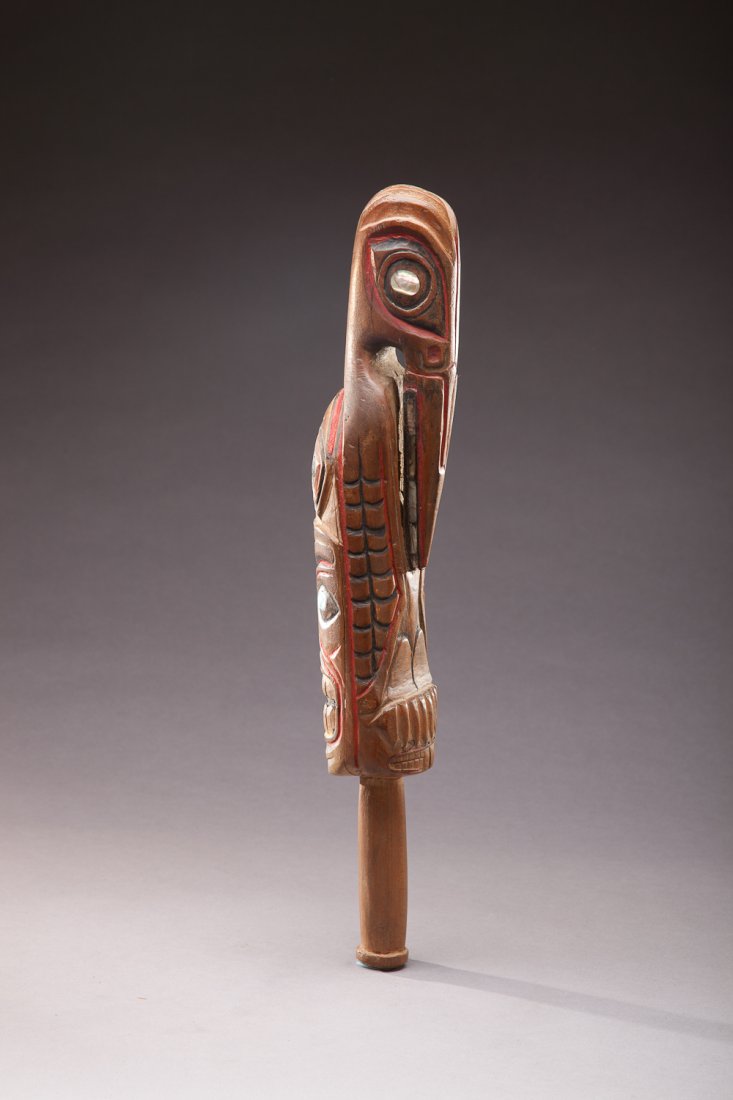 Northwest Indian Rattle: Northwest Indian Rattle Native American Pacific Northwest A sixteen-inch-long carved raven rattle with other totem motifs accented with abalone inlays. Provenance: Lunkenheimer Family Collection Wi