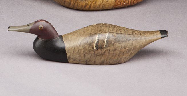 Redhead Paperweight: Redhead Paperweight Frank Adams (1871-1944) West Tisbury, Martha's Vineyard, MA, c. 1920 A six-and-three-quarter-inch-long carved wooden paperweight with an inset lead weight. Retains a partial maker'