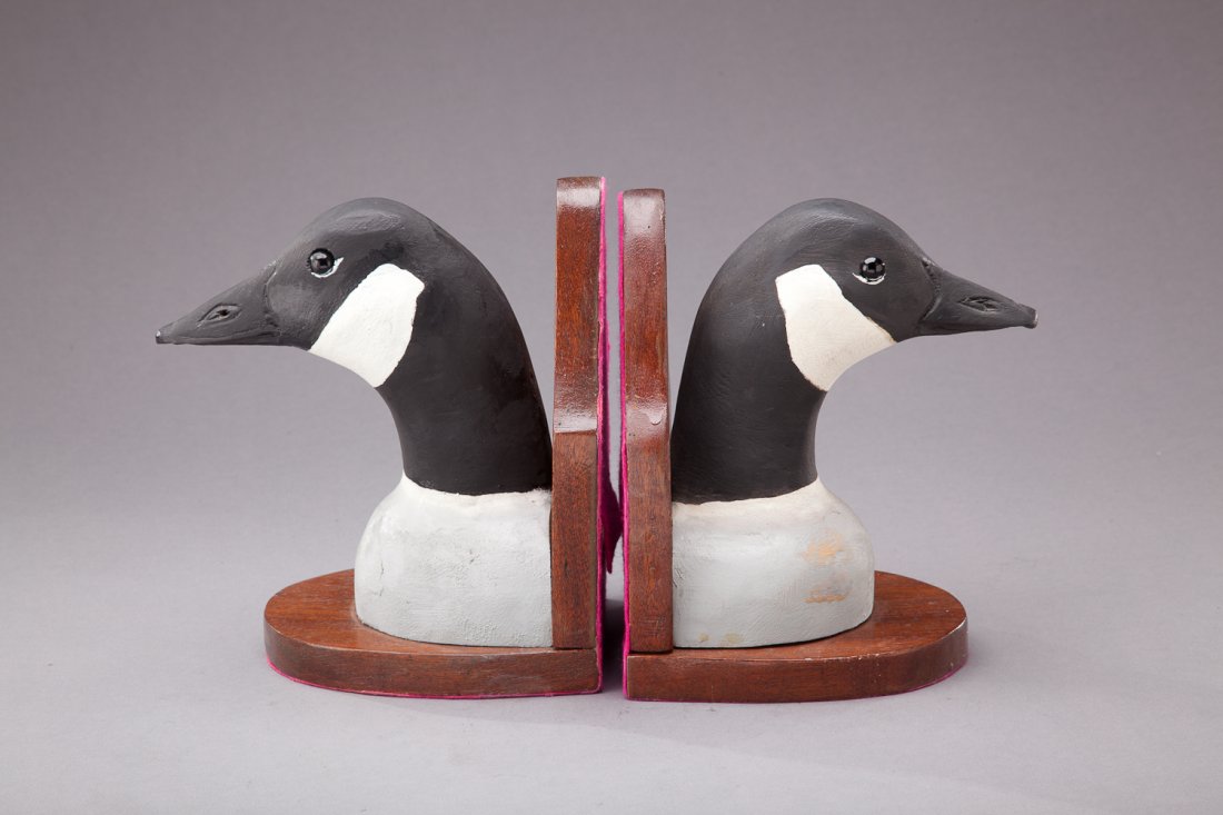 Canada Goose Book Ends: Canada Goose Book Ends Stephen Ward (1895-1976) Crisfield, MD, 1973 A pair of bookends with glass eyes and detailed bill carving. Each is signed and dated on the back. Provenance: John Collier Collect