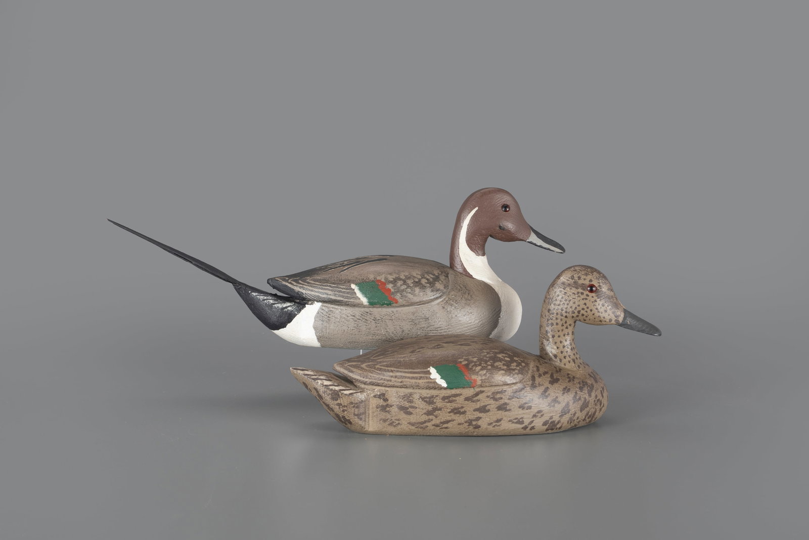 Pintail Pair by Leo Tocchini (1904-1989): Pintail Pair Leo Tocchini (1904-1989) Oakland, CA, 1981 16 1/2 in. The underside of this pair is signed and dated. Original paint with light wear and drake has a reset tail. Provenance: Richard and Do