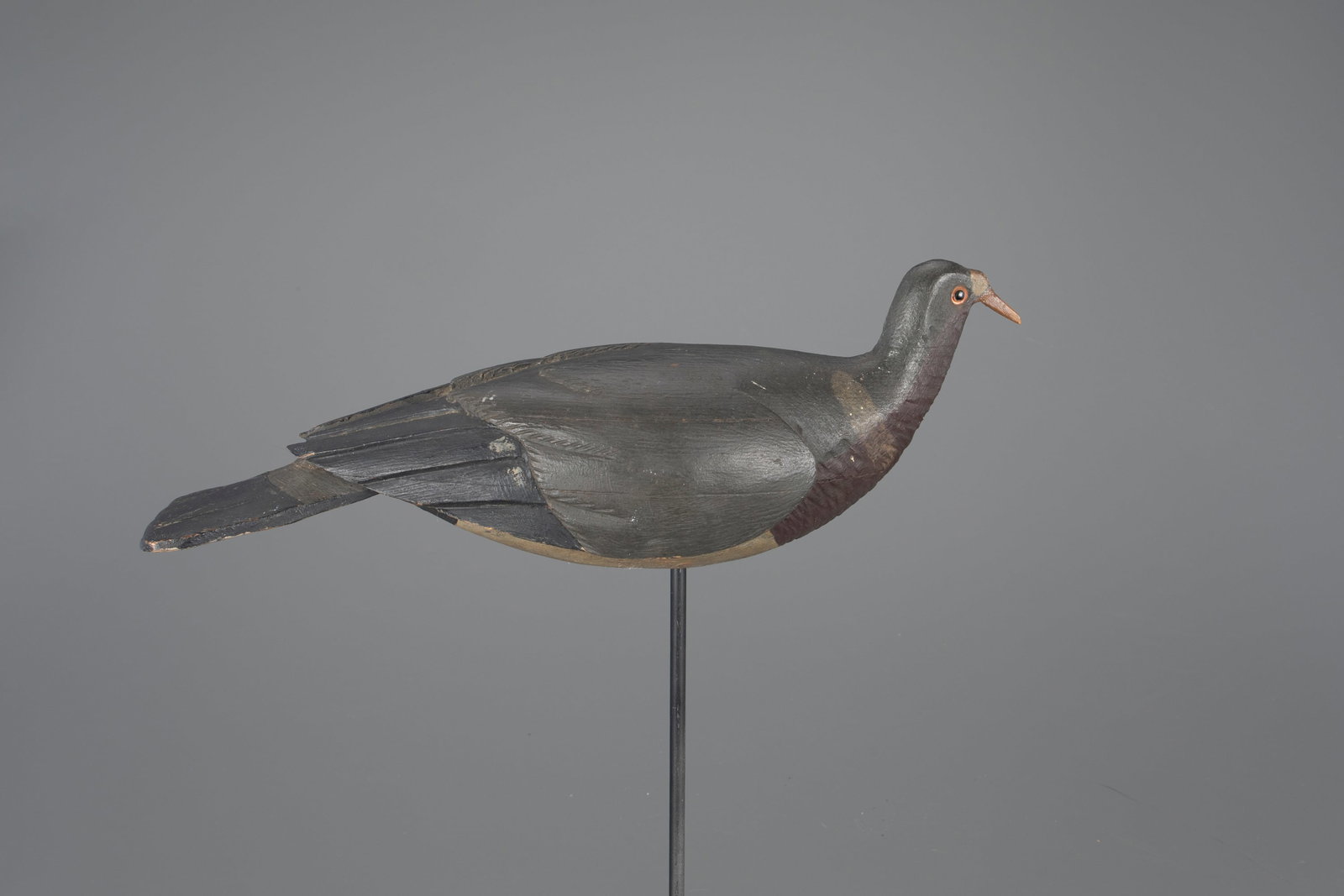 English Wood Pigeon Decoy by Trulock & Harris: English Wood Pigeon Trulock & Harris London, England, c. 1880 14 in. long Early style carving with raised wings and incised feather detail. This is a very rare example with a carved cere at the base o