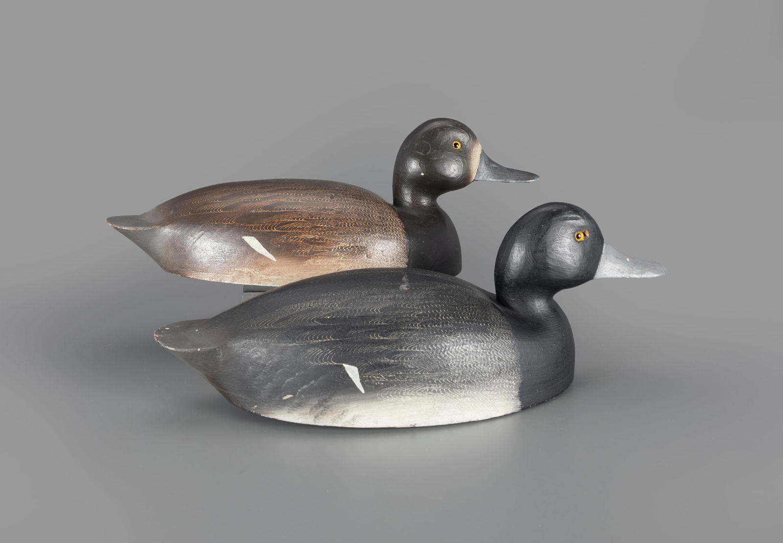 Bluebill Pair by Will Smith: Bluebill Pair Will Smith Bloomfield, Ontario, Canada, c. 1900 14 1/2 in. long A hollow pair with fine scratch comb feather detail and rig markings on the underside. In excellent Smith paint with light