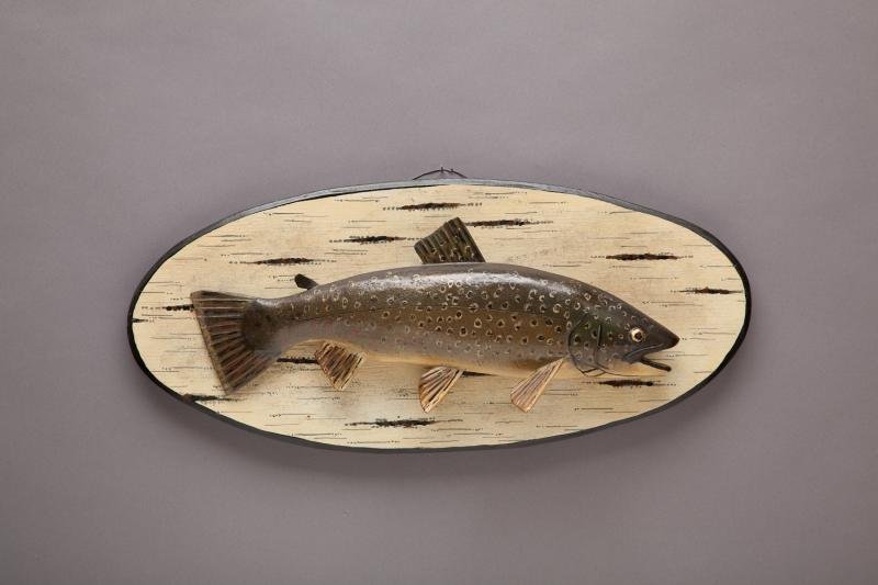 Brown Trout: Brown Trout Lawrence Irvine (1918-1998) Winthrop, ME Original Paint. A rare sixteen-inch-long brook trout carving on a faux birch bark painted beveled edge plaque. Signed by the maker on the back of t