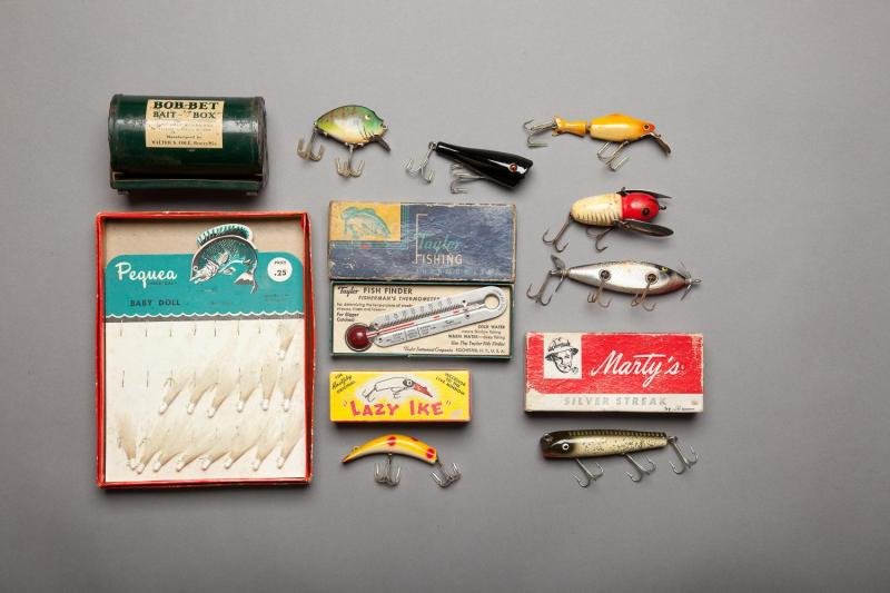 Eight Fishing Lures and a Fishing Thermometer: Eight Fishing Lures and a Fishing Thermometer As found. A couple of vintage Heddon lures, a Creek Chub, an in the box Lazy Ike, an in the box Marty's Silver Streak, a display card of Pequea baby doll 