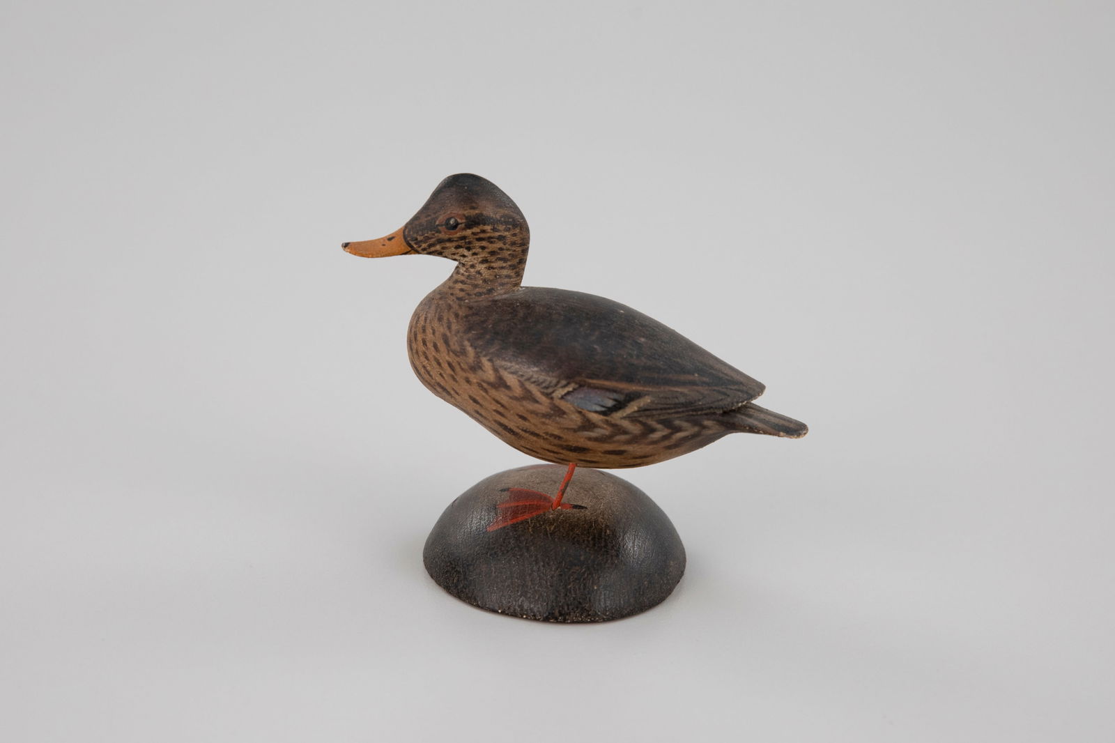 Miniature Mallard Hen by A. Elmer Crowell (1862-1952): Miniature Mallard Hen A. Elmer Crowell (1862-1952) East Harwich, MA, c. 1935 3 1/4 in. tall This hen has a turned head, rare for a Crowell miniature. Signed by the maker on the bottom of the base with