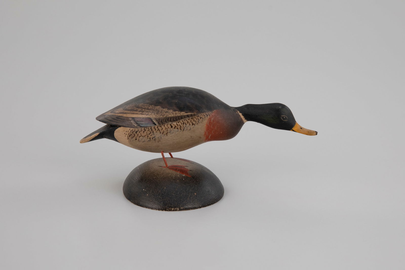Miniature Reaching Mallard by A. Elmer Crowell (1862-1952): Miniature Reaching Mallard A. Elmer Crowell (1862-1952) East Harwich, MA, c. 1935 2 1/2 in. tall Signed by the maker on the bottom of the base with his rectangular stamp. Original paint with light wea