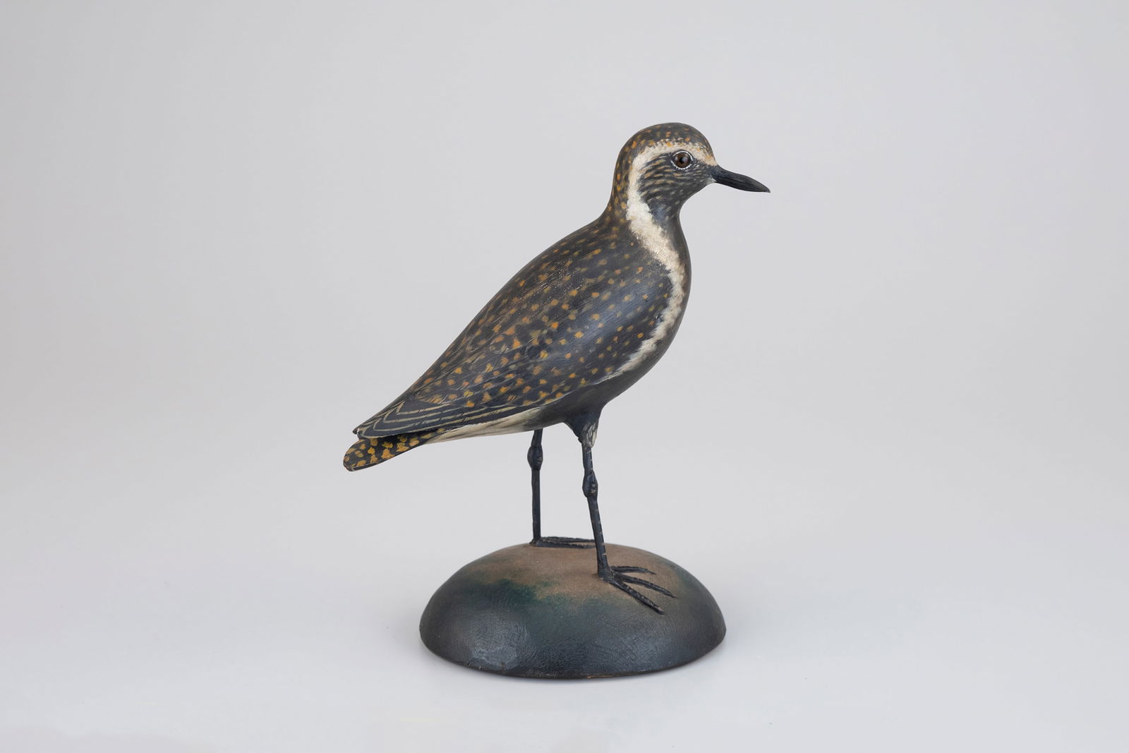 The Davenport Turned-Head Golden Plover by A. Elmer Crowell (1862-1952): The Davenport Turned-Head Golden Plover A. Elmer Crowell (1862-1952) East Harwich, MA, c. 1930 10 in. tall This carving was made by Crowell for Everett Banfield Davenport and it has remained with