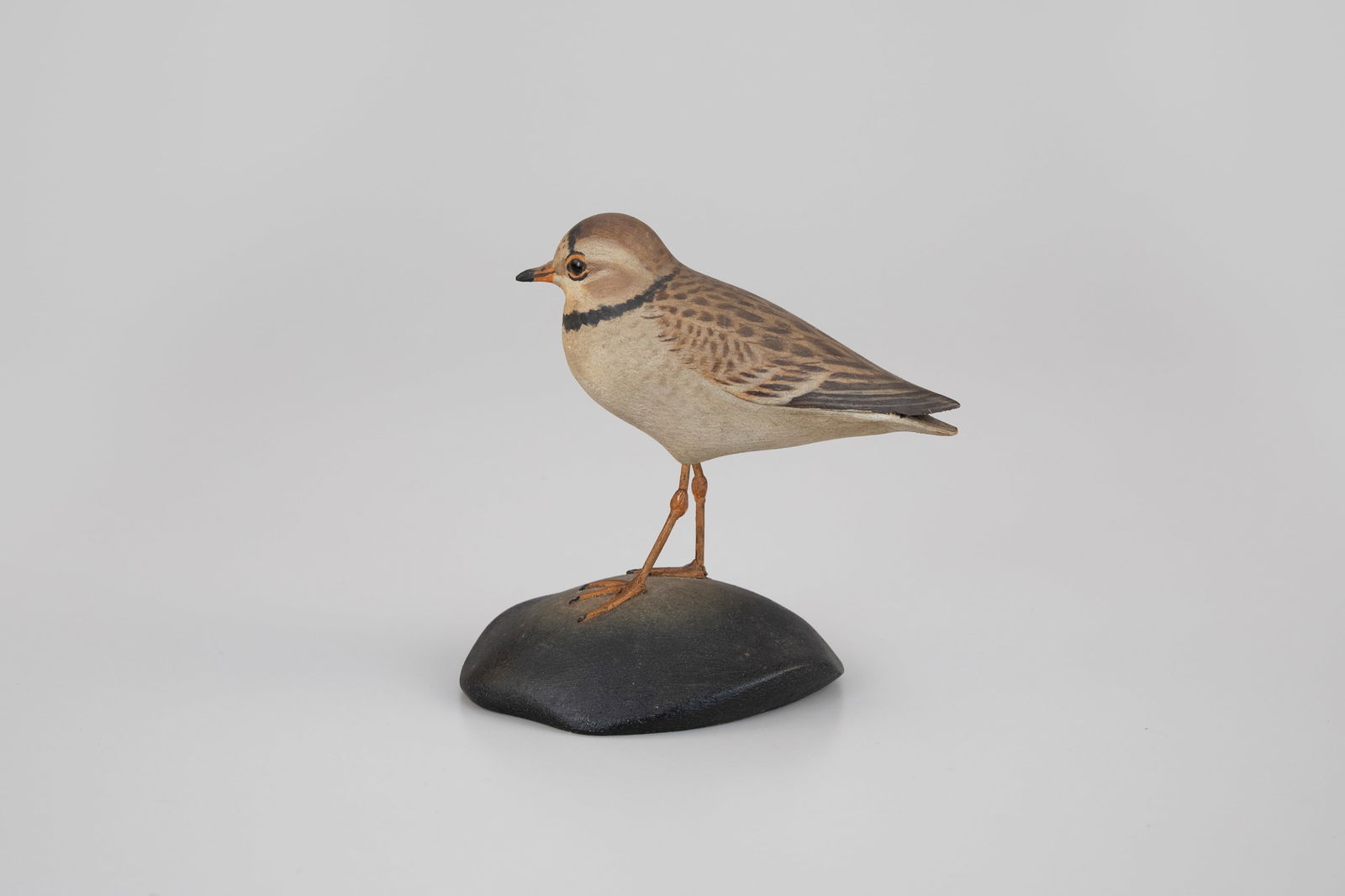 Life-Size Piping Plover by A. Elmer Crowell (1862-1952): Life-Size Piping Plover A. Elmer Crowell (1862-1952) East Harwich, MA, c. 1930 5 in. tall This mantel shorebird carving with delicately blended feathering is signed by the maker with his rectangular