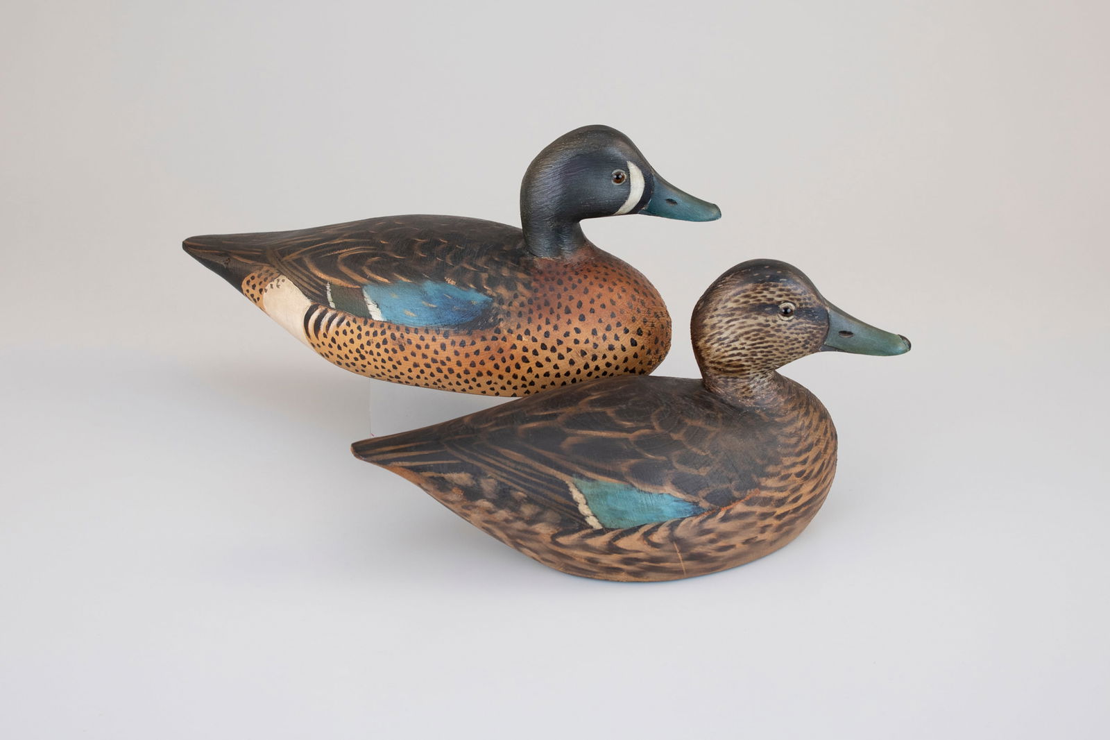 Rare Blue-Winged Teal Pair by A. Elmer Crowell (1862-1952): Rare Blue-Winged Teal Pair A. Elmer Crowell (1862-1952) East Harwich, MA, c. 1930 13 1/4 in. long As blue-winged teal are primarily a warm weather duck, Crowell made very few of this species.