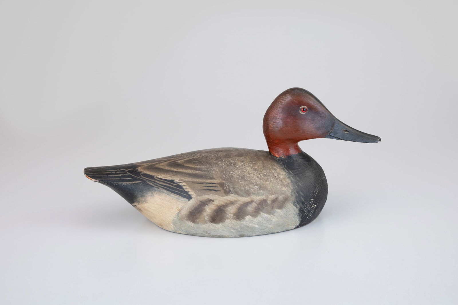 Rare Canvasback by A. Elmer Crowell (1862-1952): Rare Canvasback A. Elmer Crowell (1862-1952) East Harwich, MA, c. 1935 15 in. long As a highly regarded gamekeeper and breeder of waterfowl, Crowell possessed a thorough knowledge of avian anatomy,