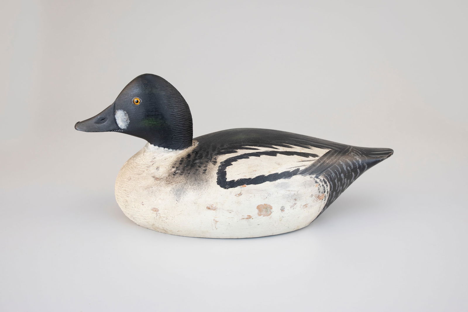 Early Goldeneye Drake by A. Elmer Crowell (1862-1952): Early Goldeneye Drake A. Elmer Crowell (1862-1952) East Harwich, MA, c. 1915 15 in. long A rare working decoy that appears to have avoided the rigors of hunting. Few, if any, makers were more