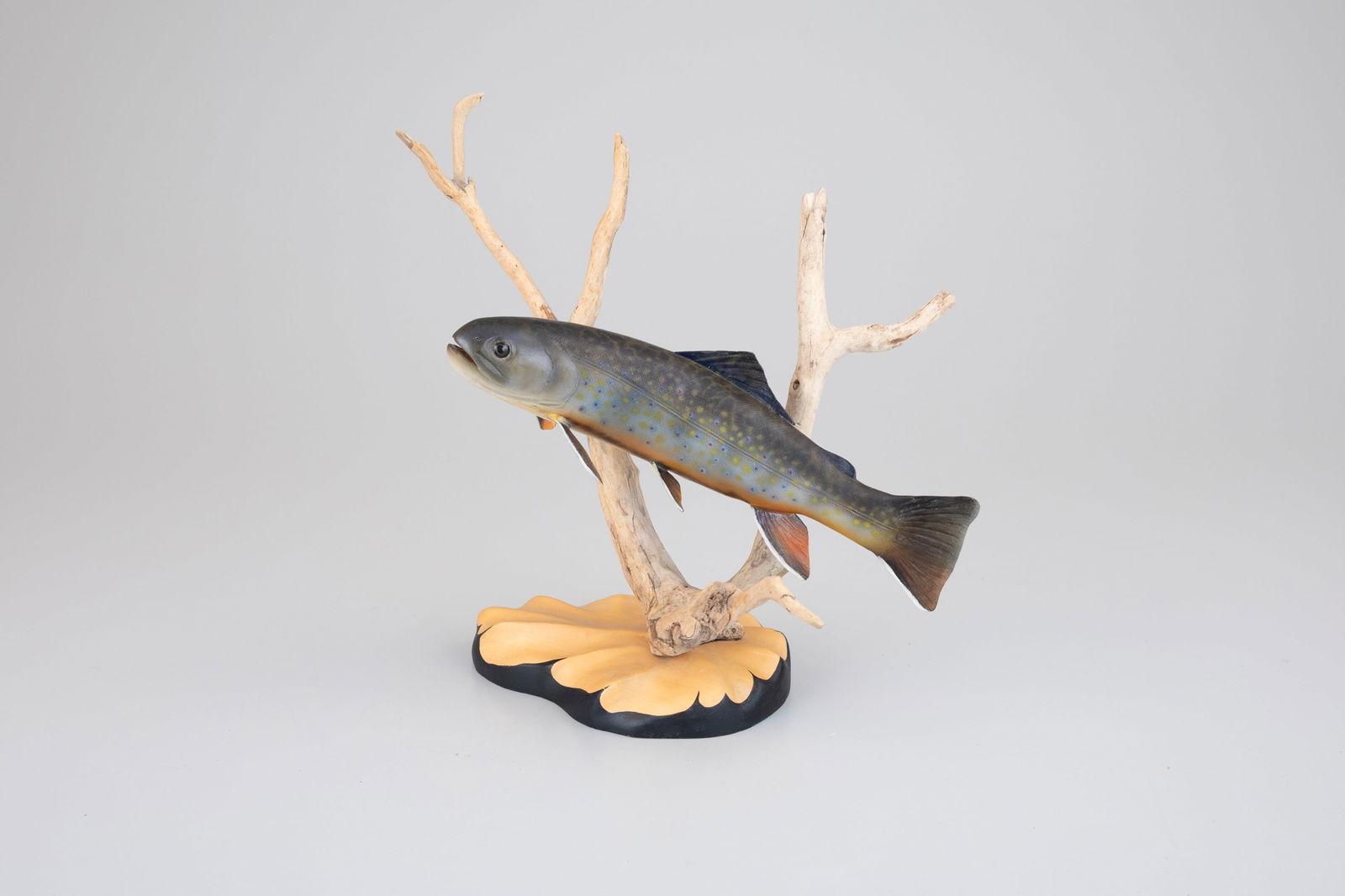 Brook Trout by Steve Weaver (b. 1950): Brook Trout Steve Weaver (b. 1950) Sandwich, MA, 1996 12 by 14 by 8 in. Signed and dated by the artist on the underside of its base. The branch bears the maker's burned initials. Original paint with