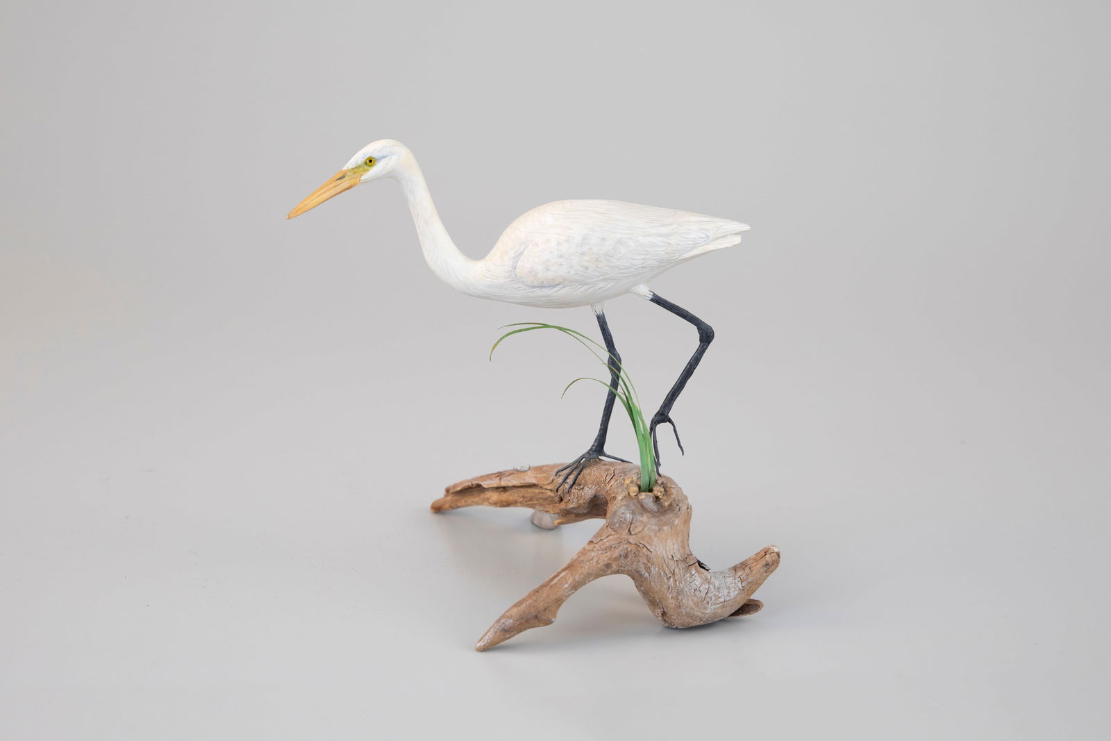 Miniature American Egret by Steve Weaver (b. 1950): Miniature American Egret Steve Weaver (b. 1950) Sandwich, MA, 2017 7 in. long, 6 3/4 in. tall Titled "Cautious Approach," signed and dated by the artist on the underside of its branch base. The top