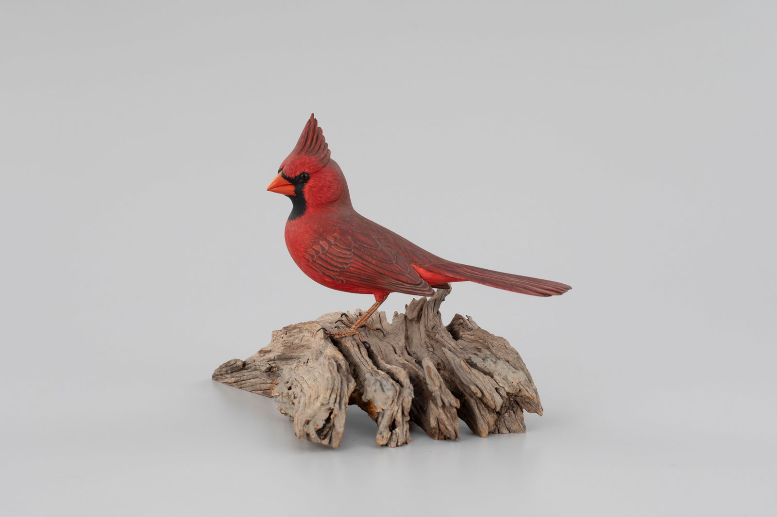 Life-Size Cardinal by Arnold T. Melbye (1909-2000): Life-Size Cardinal Arnold T. Melbye (1909-2000) South Yarmouth, MA, c. 1970 7 3/4 in. tall, 11 in. long This dropped-wing carving has finely incised feather detail and a turned head. Signed by the