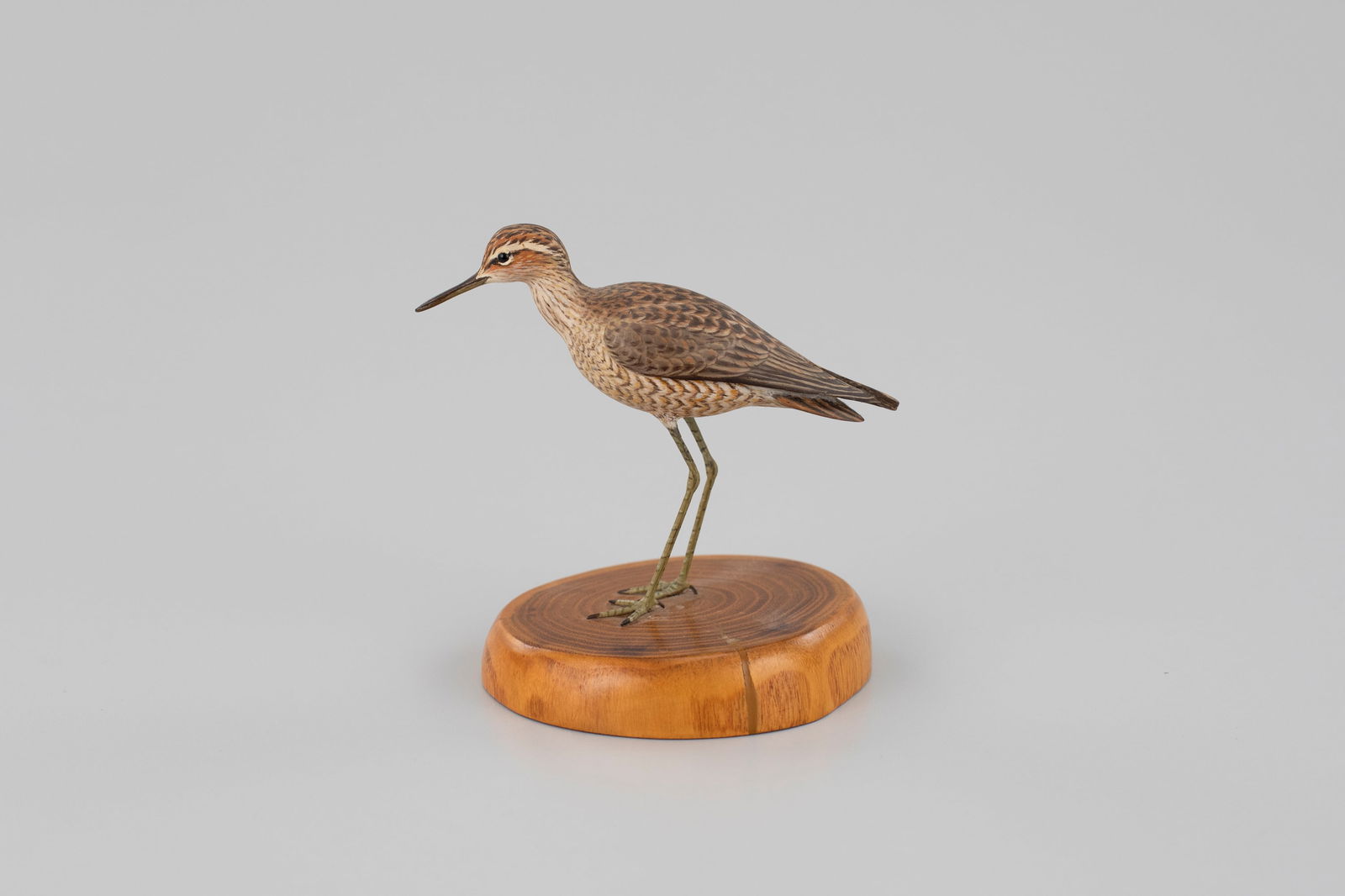 Miniature Stilt Sandpiper by Arnold T. Melbye (1909-2000): Miniature Stilt Sandpiper Arnold T. Melbye (1909-2000) South Yarmouth, MA, c. 1967 4 in. tall Signed on the underside and bears the maker's label. This carving's form, paint, and design illustrate