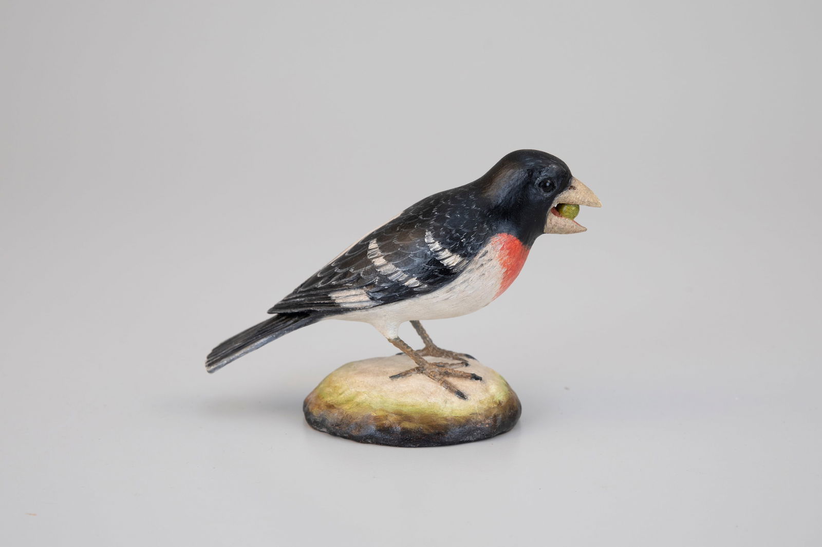 Rose-Breasted Grosbeak by Frank Finney (b. 1947): Rose-Breasted Grosbeak Frank Finney (b. 1947) Capeville, VA 7 in. long Signed by the maker with his incised "F" on the underside. Original paint with light wear.
