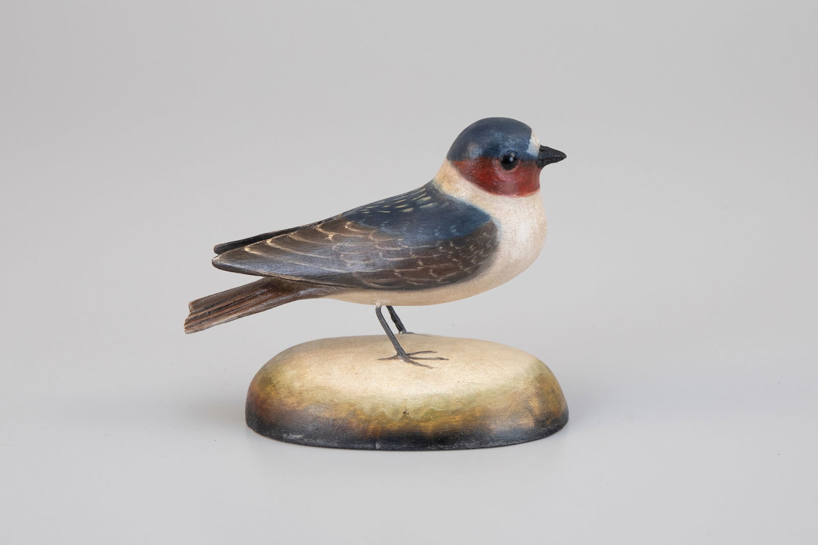 Cliff Swallow by Frank Finney (b. 1947): Cliff Swallow Frank Finney (b. 1947) Capeville, VA 5 in. long Signed by the maker with his incised "F" on the underside. Original paint with light wear.