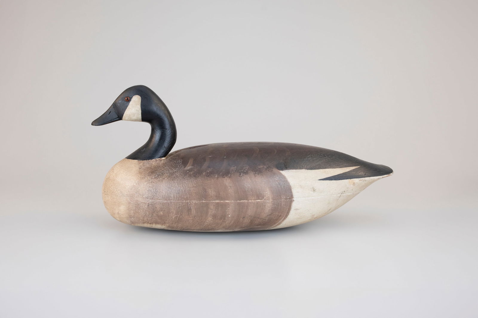 O'Brien-Johnson Canada Goose by Nathan Rowley Horner (1882-1942): O'Brien-Johnson Canada Goose Nathan Rowley Horner (1882-1942) West Creek, NJ, c. 1930 21 1/2 in. long An exceptional and rare Horner goose made with the maker's signature tucked-head style found in hi