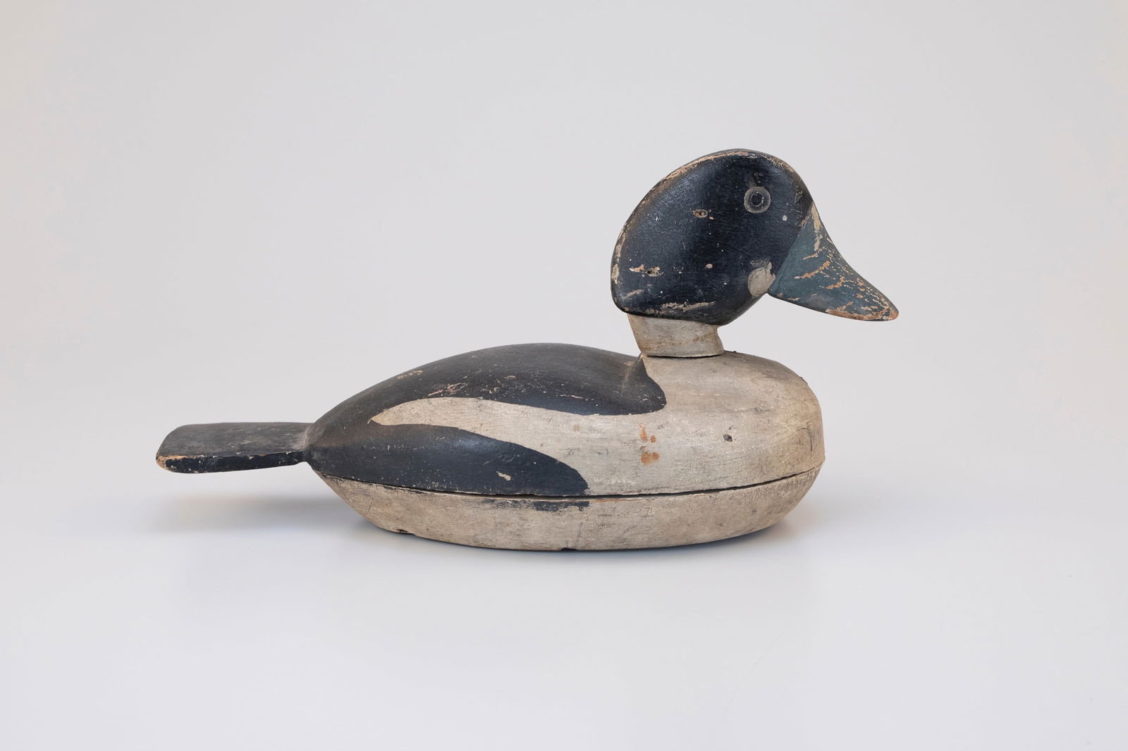 Rare Goldeneye by Amos Wheaton (1853-1921): Rare Goldeneye Amos Wheaton (1853-1921) Seaville, NJ, c. 1890 13 1/2 in. long These folky decoys have long been celebrated for the artist's unique take on the goldeneye's pronounced head shape. This