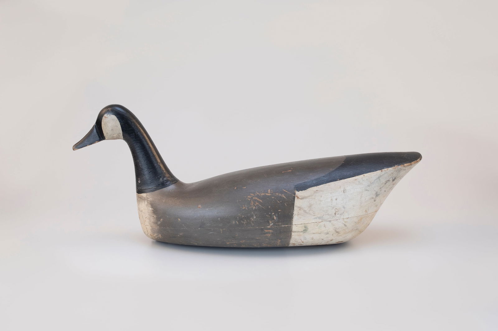 Swimming Goose by Chris Sprague (1888-1982): Swimming Goose Chris Sprague (1888-1982) Beach Haven, NJ, c. 1930 25 in. long A large hollow swimming decoy with a star-head nail in the rigging and Sprague's notes under the tail. Original paint