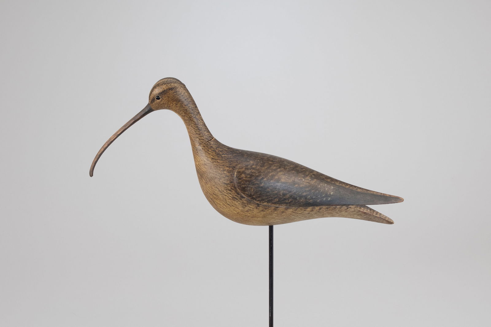 Long-Billed Curlew #4 by Mark McNair (b. 1950): Long-Billed Curlew #4 Mark McNair (b. 1950) Craddockville, VA, c. 2019 18 in. long The carving's construction includes a mortise-and-tenon head and a hollow body secured with pegs. The head is