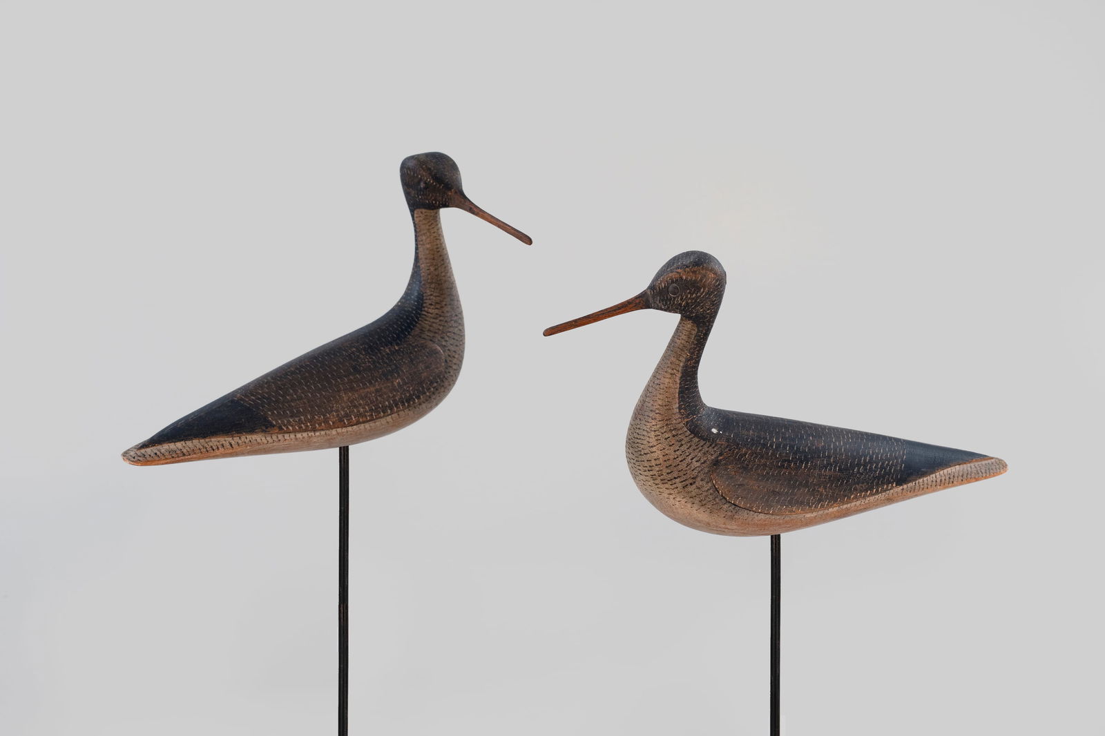 "Egyptian" Yellowlegs Pair by Mark McNair (b. 1950): "Egyptian" Yellowlegs Pair Mark McNair (b. 1950) Craddockville, VA, c. 1990 11 1/2 in. long These "Egyptian yellowlegs" display turned heads, fine stippling, and an incised "McNair" on the