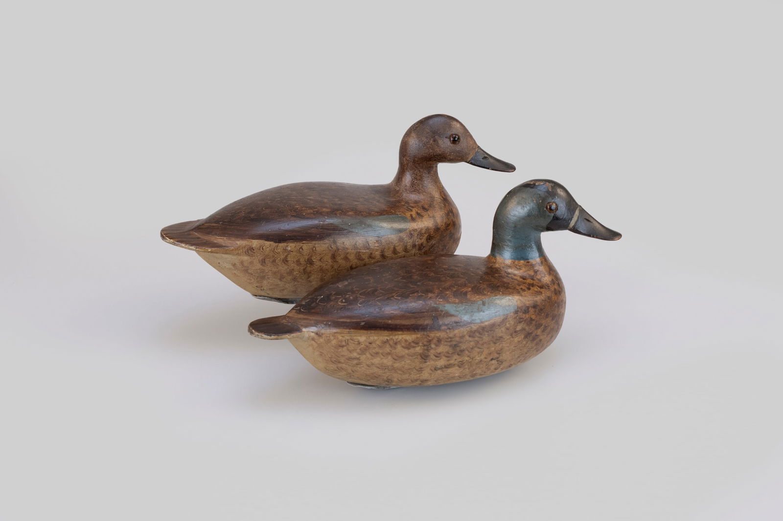 The Masterworks Graves Teal Pair by Bert Graves (1880-1956): The Masterworks Graves Teal Pair Bert Graves (1880-1956) Peoria, IL, c. 1925 10 1/2 in. long Teal decoys in good original paint by the top Illinois river decoy makers are exceedingly rare; only a hand