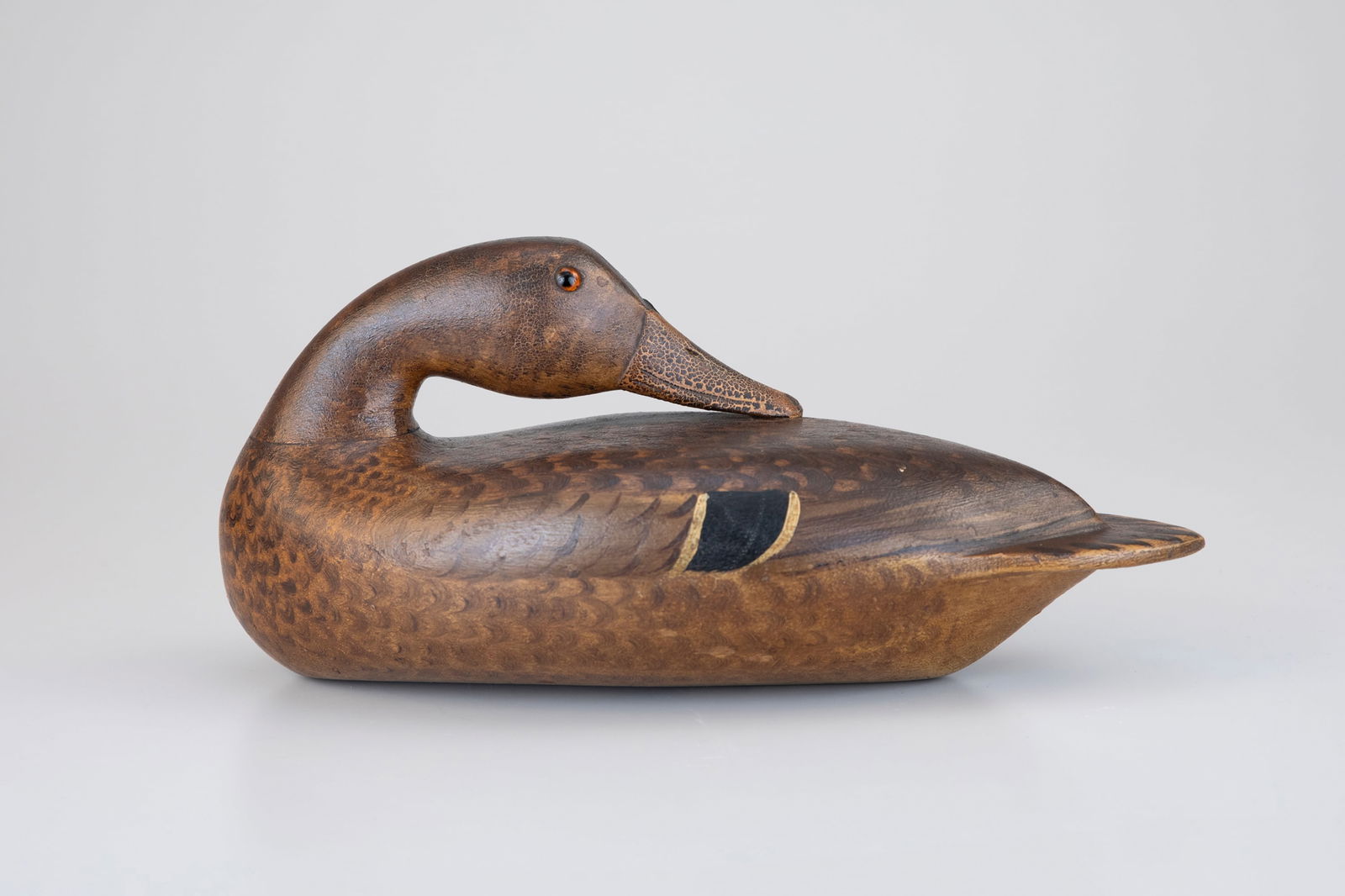 Exceptional Preening Mallard Hen by Bert Graves (1880-1956): Exceptional Preening Mallard Hen Bert Graves (1880-1956) Peoria, IL, c. 1920 14 1/2 in. long Graves built the Graves Decoy Company out of the workshop behind his home. Upon the death of Robert Ellisto
